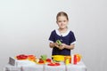 Girl five years preparing soup