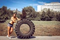 Girl flipping tire during exercise