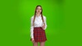 Girl flirts now . Green screen