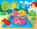 Girl floating on inflatable flamingo 2