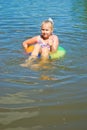 Girl floating in the river Royalty Free Stock Photo