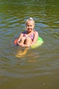 Girl floating in the river Royalty Free Stock Photo