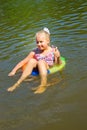 Girl floating in the river Royalty Free Stock Photo