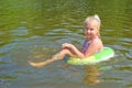 Girl floating in the river Royalty Free Stock Photo
