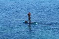 Girl floating on a SAP-board