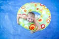 Girl floating in swimming pool Royalty Free Stock Photo