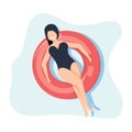 Girl floating on the water, sunbath on ring in the swimming pool or sea. Summer vacation, relaxation, resort