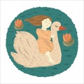 The girl floats on a white swan on the lake among the lotuses. Royalty Free Stock Photo