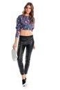 Girl in floral crop top.