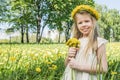 Girl with floral head wreath and bunch Royalty Free Stock Photo