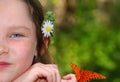 Girl With Flower and Butterfly Royalty Free Stock Photo