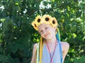 Girl with flower decoration on the head looks. Royalty Free Stock Photo