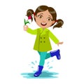 Girl With The Flower, Kid In Autumn Clothes In Fall Season Enjoyingn Rain And Rainy Weather, Splashes And Puddles