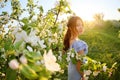 Girl in a flowering garden