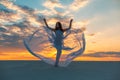 A girl in a fly white dress dances and poses in the sand desert at sunset Royalty Free Stock Photo