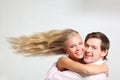 Girl with flying hair embraces young man Royalty Free Stock Photo