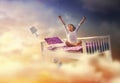 Girl is flying in her bed Royalty Free Stock Photo