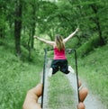 Girl flying in a jump on the background of the mountains Royalty Free Stock Photo