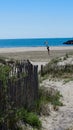 Girl flying a kite. Holidaying at the beach and having fun