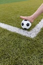 Girl foot on the soccer ball on green field Royalty Free Stock Photo