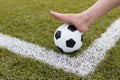 Girl foot on the soccer ball on green field Royalty Free Stock Photo