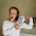 Girl with Afikoman is a half piece of matzah which is broken of the Passover Seder. Royalty Free Stock Photo