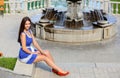 Girl at a fountain