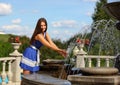 Girl at a fountain