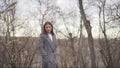 Girl freezes standing in a coat in the autumn in the park.. young pretty girl in cold weather outdoors, vintage portrait