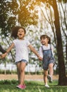 Girl and friend holding hands walking