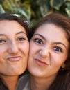 Girl friends, happy and selfie outdoor with silly, pout and students with a smile in a park. Garden, youth and funny Royalty Free Stock Photo