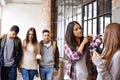 Girl friends talk, university hallway and people with conversation and discussion together. Teenager, college and school Royalty Free Stock Photo