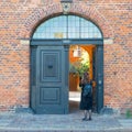 Girl in front of an authentic danish building