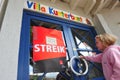 Girl in front of closed kindergarten because of strike