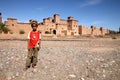 Girl in front of Kasbah in Skoura Royalty Free Stock Photo