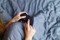 Girl gamer playing video game with wireless joystick at home. Gamepad in female hands close-up, gaming addiction concept, woman Royalty Free Stock Photo