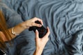 Girl gamer playing video game with wireless joystick at home. Gamepad in female hands close-up, gaming addiction concept, woman Royalty Free Stock Photo