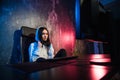 Girl gamer wearing headphone playing network games preparing to participate in international competitions in esports Royalty Free Stock Photo