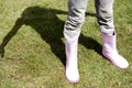 Girl in gardening boots in the garden. Conceptual image shot