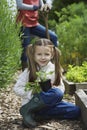 Girl Gardening With Mother In Field Royalty Free Stock Photo