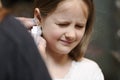 Girl getting her ears pierced Royalty Free Stock Photo