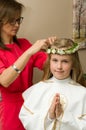 Girl getting ready for her first holy communion event Royalty Free Stock Photo