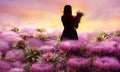 The girl is among the giant lilac flowers. Fantasy picture. Royalty Free Stock Photo