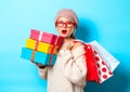 Girl with gift boxes and shopping bags Royalty Free Stock Photo