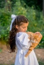 Girl with ginger cat. Beautiful portrait of girl with ginger cat in the hands.
