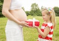 Girl gives a gift to mum Royalty Free Stock Photo