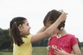 Girl Giving Friend Daisy Chain