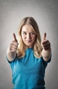 Girl giving thumbs up Royalty Free Stock Photo