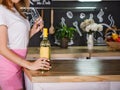 Girl with a glass and a bottle of white wine. Royalty Free Stock Photo