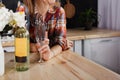 Girl with a glass and a bottle of white wine. Royalty Free Stock Photo